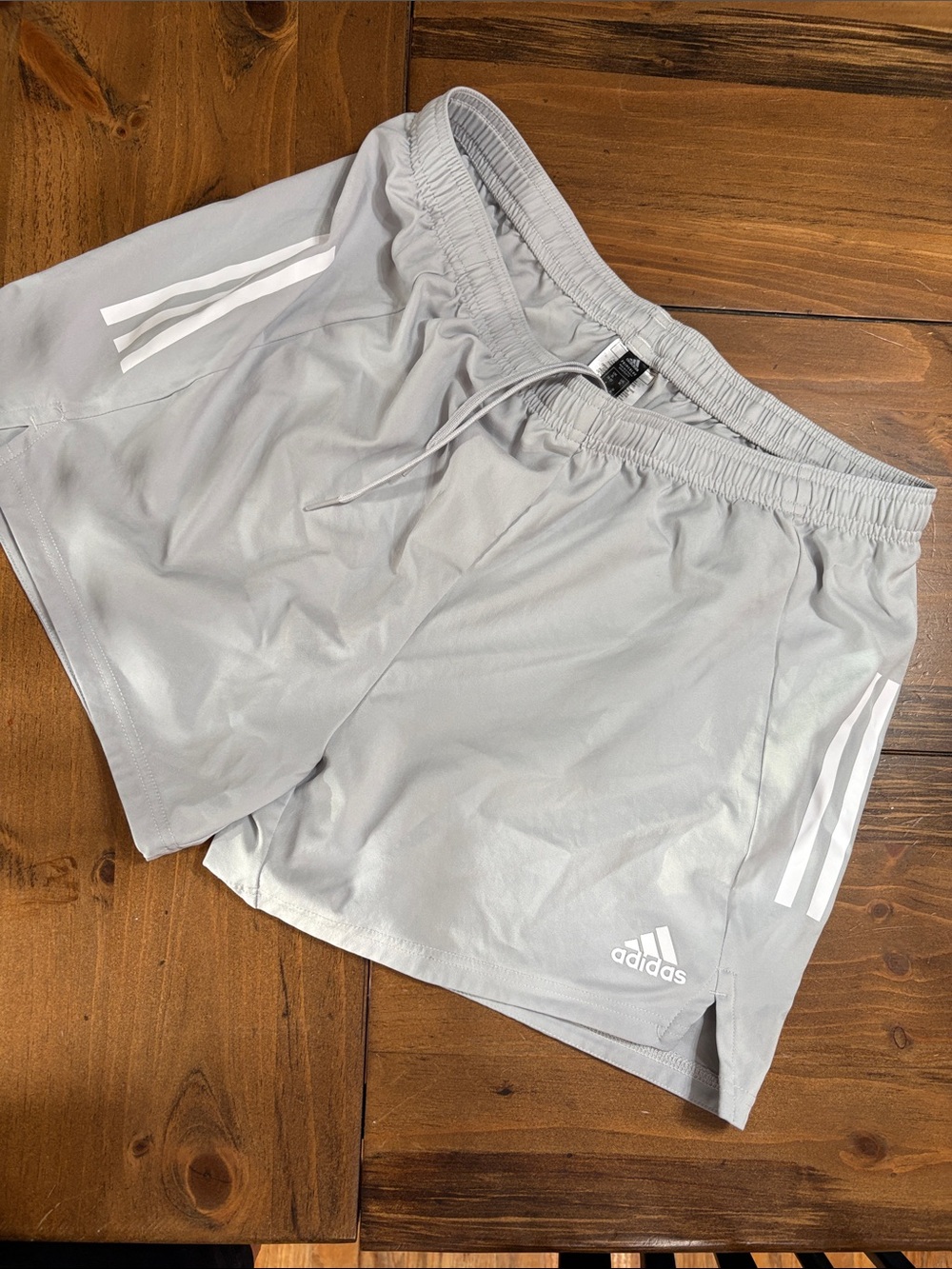 adidas women’s drawstring light Gray Athletic Shorts with White Stripes